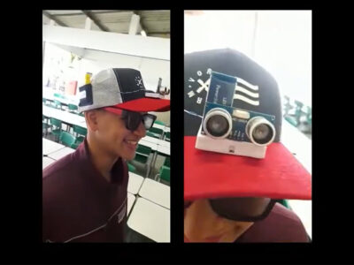 Dispositivo eletrônico acoplado a um boné é voltado à segurança de pessoas com deficiência visual l Foto: Reprodução/Youtube